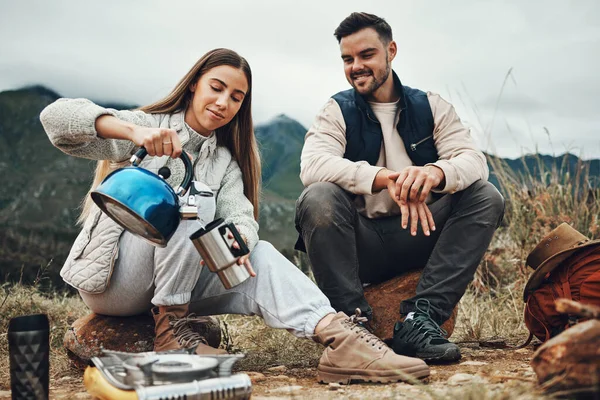 Camping, water and couple for coffee in morning for trekking, adventure and freedom. Travel, nature and man and woman with kettle for warm drink, beverage and tea on holiday, vacation and hiking.