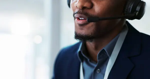 Closeup, man and mouth consulting in call center, customer service or telemarketing at office. Lips of male person, consultant or agent talking on headphones for online advice, help or contact us.