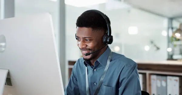 Happy black man, face and call center in customer service, support or telemarketing at office. African male person, consultant or agent with headphones for consulting in contact us or online advice.