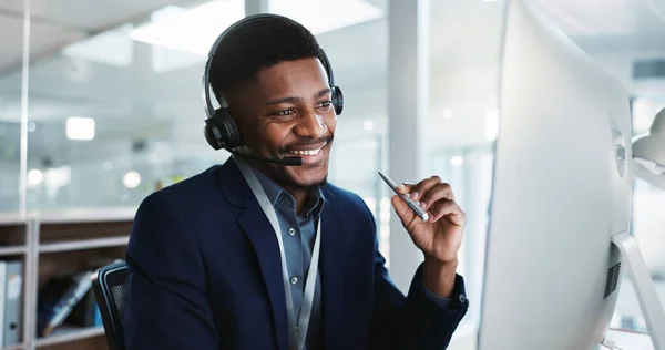 Computer, call center and black man talking, telemarketing and technical support at help desk. Communication, customer service and happy sales agent consulting, crm advisory and speaking to contact.