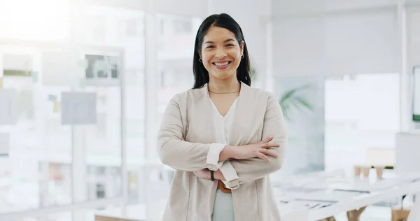 Portrait of businesswoman, smile in office and arms crossed, project manager at engineering agency. Face of happy woman, design business leader with pride and confidence for entrepreneur at startup
