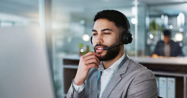 Businessman, face and consulting in call center, customer service or telemarketing at office. Corporate man, consultant or agent talking with headphones in online advice or communication at workplace.