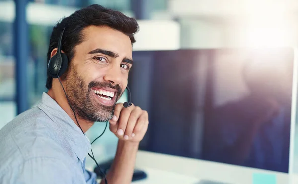 Portrait, telemarketing and man with a computer, call center and lens flare with headphones, crm and tech support. Face, office or agent with a headset, customer service and help desk with consultant.