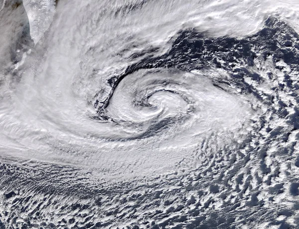Hurricane, cyclone or weather pattern for warning of natural disaster or destruction from mother nature. Earth, sky and cloud formation of a storm in winter from a satellite to view a tornado.