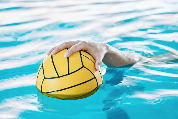 Ball, hand and water polo, swimming pool and sports with fitness, athlete and training for game. Person, swimmer and equipment with exercise, closeup and aquatic workout with challenge and match.