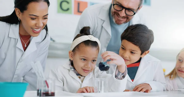 Science, education and students in a classroom with their teachers for learning or to study chemistry. Children, school and scholarship with kids in a lab for an experiment of chemical reaction.
