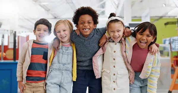 Science, portrait or group of children with smile at convention, expo or exhibition for learning. Kid or face with diversity at tradeshow or scientific conference for knowledge, workshop or education.