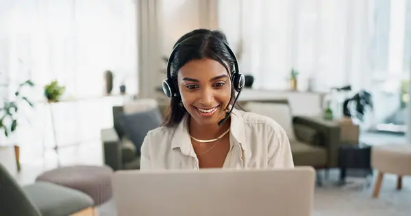 Happy woman, call center and headphones on laptop in customer service, support or telemarketing at home office. Face of female person, consultant or freelance agent in remote work for online advice.