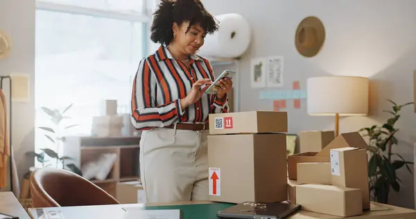 Happy woman, phone and boxes in small business, logistics or communication in customer service or online order. Female person or employee on mobile smartphone in retail shipping or networking at shop.