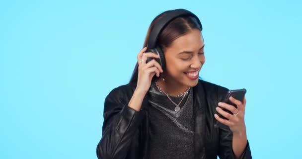Woman Dancing Music Smartphone Headphones Listening Playlist Energy Blue Background — Stock Video