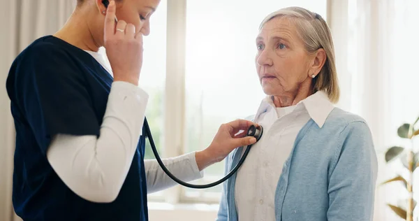 Elderly woman, nurse or stethoscope for healthcare, examination or chest problem at hospital or clinic. Medical, senior person and caregiver or professional for lung health, heart check or cardiology.