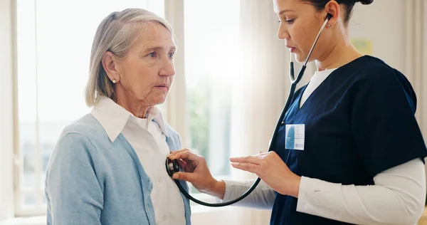 Senior woman, nurse or stethoscope for healthcare, examination or chest problem at hospital or clinic. Medical, elderly person and caregiver or professional for lung health, heart check or cardiology.