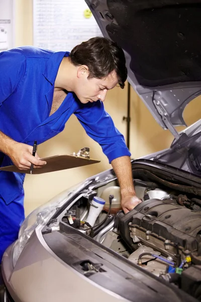 Checklist, man and technician check engine of car, repair and maintenance. Clipboard, mechanic and serious person on motor vehicle hood, fixing transport and inspection list at auto service garage.