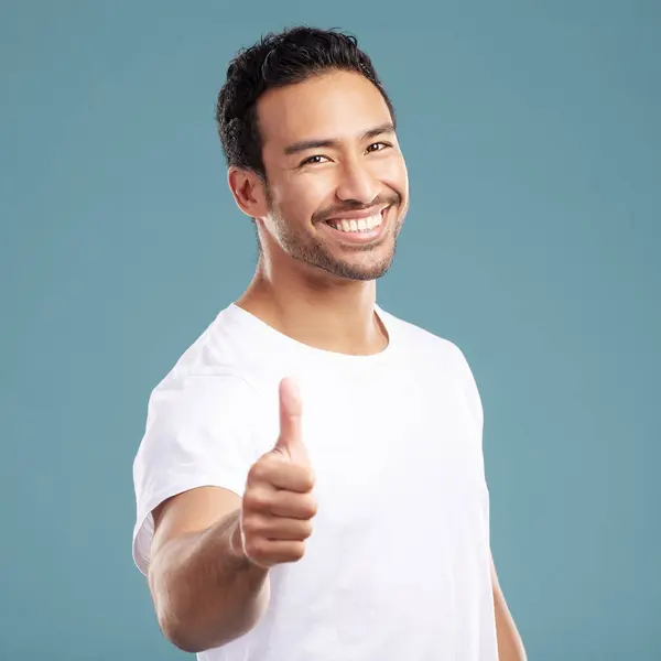 Handsome Young Mixed Race Man Giving Thumbs While Standing Studio — Stockfoto