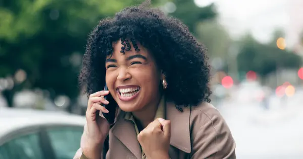 Phone call, excited or woman in celebration in city for good news, achievement or winning a competition. Wow, winner or happy worker cheering for success, bonus or reward in urban street or CBD.