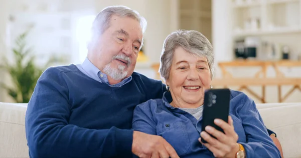 Home, relax and senior couple with smartphone, smile and connection with social media, speaking and email. Digital app, mature man and old woman with cellphone, mobile user and website information.