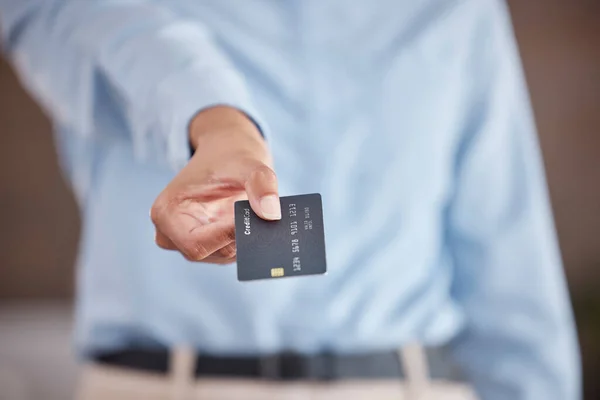 Close up of females hands holding out credit card. Business woman showing card for payment or advertising mockup bank card with online service