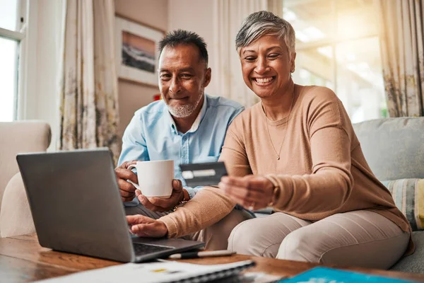 Senior couple, credit card and laptop for home online shopping, payment and fintech, savings or loan. Happy elderly woman and man with debit, banking investment and finance or e commerce on computer.