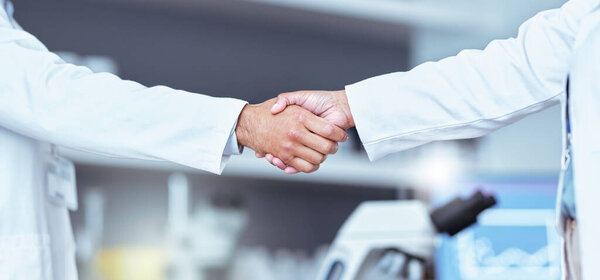 Hand shake, partnership and lab scientist, people or team work, collaboration and cooperation on medical science. Doctors, teamwork and closeup partner handshake for unity, agreement or staff welcome.