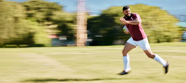 Rugby, running and speed of an athlete with energy and sports ball on a grass field. Workout, game exercise and fast runner moving with action and intense cardio for sport and match training outdoor.