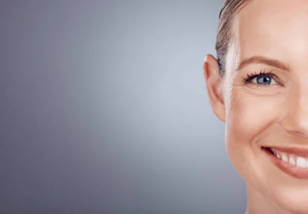 stock image Half face, woman and mockup portrait of beauty for wellness, studio and happy salon results. Closeup model, split facial and skincare of facial aesthetic, laser dermatology and smile on mock up space.