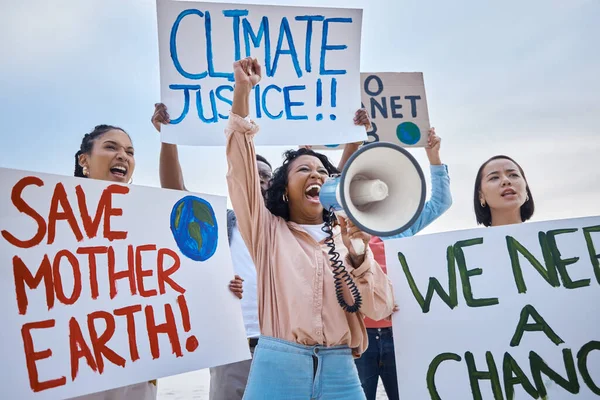 Black woman, climate change and megaphone protest with crowd protesting for environment and change. Save earth sign, group activism and angry people shouting on bullhorn to stop planet pollution
