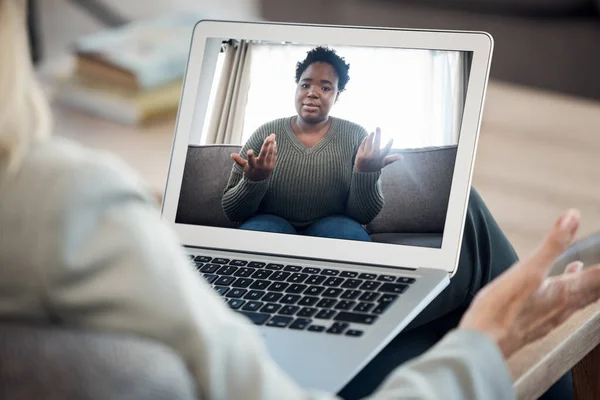 Woman, video call and therapy on laptop screen for support, advice or helping with mental health in online meeting. Virtual psychologist or therapist talk to client or african person on computer.