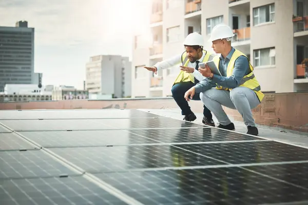 Solar panels, teamwork and people with tablet for construction, maintenance and planning inspection. Sustainability, renewable energy and electricians with digital tech for photovoltaic electricity.