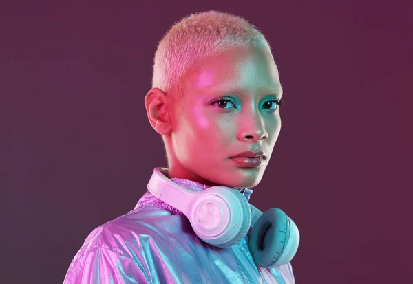 Vaporwave fashion, chroma clothing and portrait of black woman with headphones in studio. Futuristic style, gen z and cosmetics of a young person isolated with cyber and technology aesthetic.