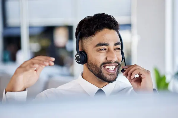 Call center, telemarketing and man with customer service, talking and communication with headphones. Male person, happy consultant and employee with a headset, crm and tech support with telecom sales.