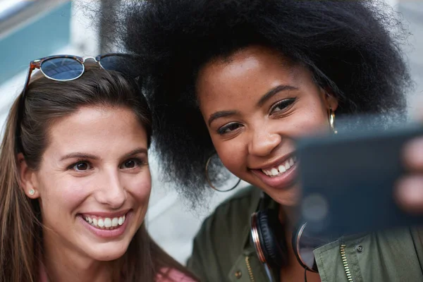 stock image Student women, selfie and friends in city with diversity, profile picture or happy on travel. Happiness, smartphone or solidarity for social media, blog and post for woman group on urban adventure.