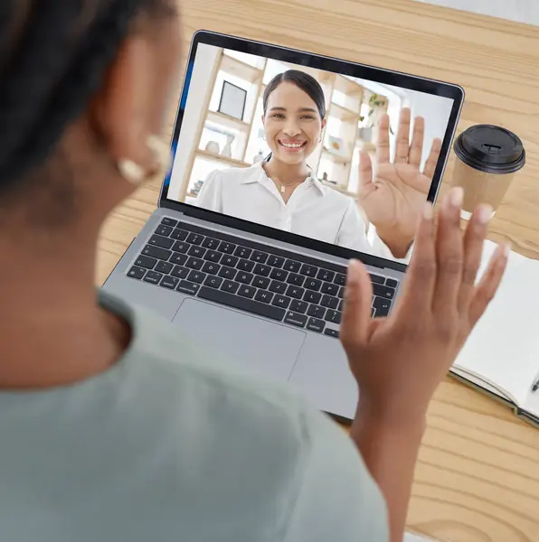 Video call, wave and employees in a meeting for business, marketing and networking on a laptop at a desk in the office at work. Manager greeting on pc screen during virtual webinar with worker.