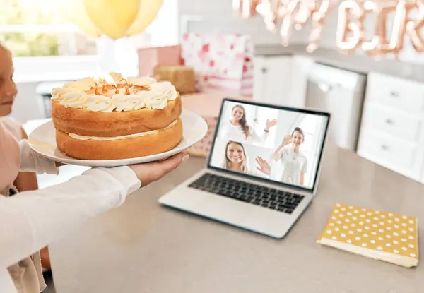Family, birthday party and a laptop video call, zoom and online celebration in lockdown, quarantine and social distancing. Children and distant friends celebrating event with cake and dessert at home.