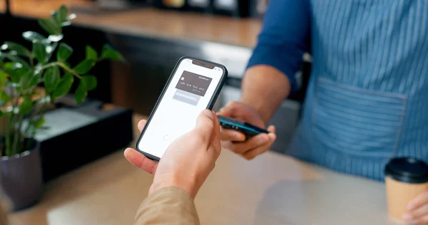 Fintech, phone or hands of customer in cafe with cashier for shopping, sale or payment in checkout. Machine, bills or closeup of person paying for service, coffee or tea drink in restaurant or diner.