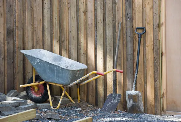 Wheelbarrow Spade Placed Amongst Gravel Building Material Construction Site Home — Stock Photo, Image