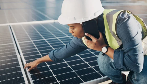 Phone call, solar panel and black woman maintenance conversation about photovoltaic plate, sustainability or inspection. Renewable energy, smartphone chat and female engineer check electricity cell.