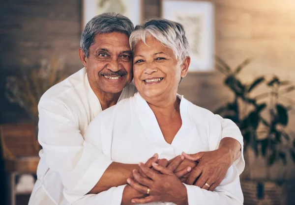 Happy, hug and portrait of old couple in spa for retirement, beauty treatment and skincare. Wellness, smile and love with senior man and woman relax in salon for massage, hospitality and vacation.