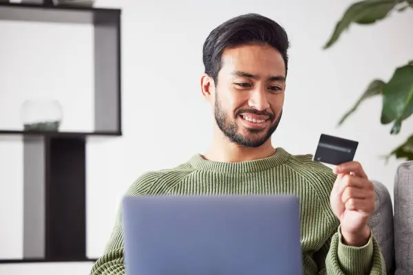 Laptop, ecommerce or happy man online shopping with credit card for digital product with discount code. Smile, promo or customer with financial payment to buy on sale on fintech application at home.