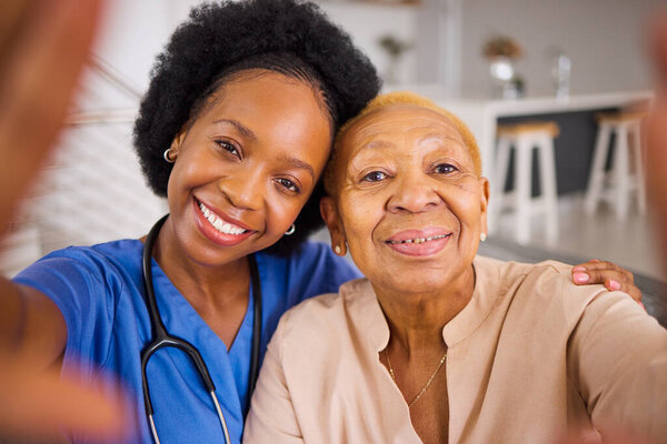 Black people, nurse and hug in elderly care for selfie, love or support and trust together at home. Portrait of happy African medical caregiver with senior female person smile for photo in the house.