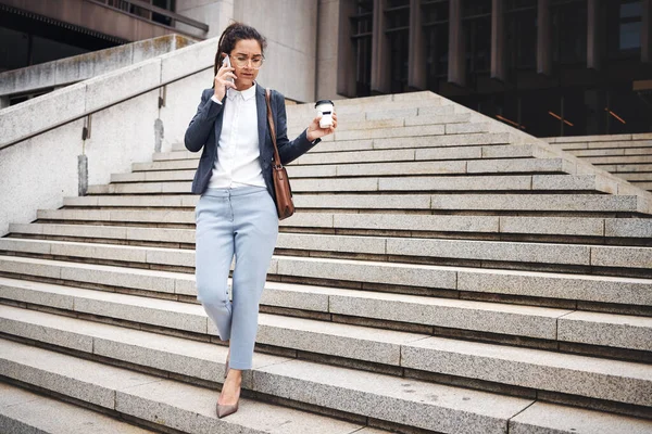 Stairs, city phone call and business woman walk, travel and talking on cellphone communication, discussion or chat. Smartphone, coffee break and urban person leave office building on staircase steps.
