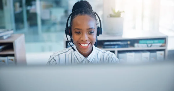 Black woman, call center and consulting on headphones in customer support, service or telemarketing at office. African female person, consultant or agent talking in online advice or help at workplace.