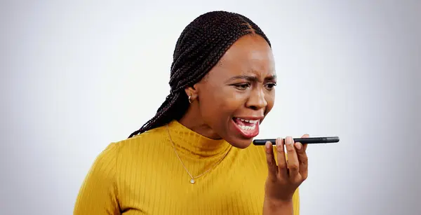 Phone, black woman and angry from scam conversation and anxiety from problem and fail. Studio, white background and frustrated female person with spam communication and identity theft mistake.