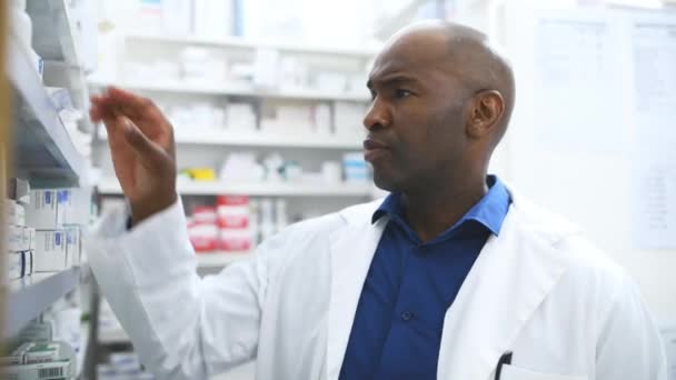 Black Man Pharmacist Box Shelf Medication Inventory Inspection Dispensary Drugstore — Stock Video