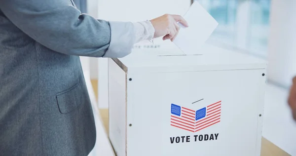 Hand, usa and president election or ballot paper document at poll station, government or choice. Man, fingers and opinion at booth for American campaign or democracy day change, patriotic or vote box.
