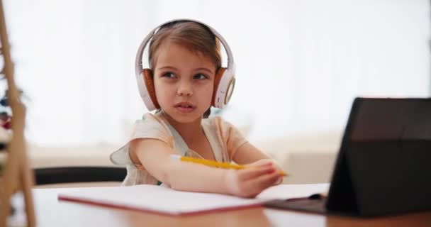 Writing Homework Girl Tablet Headphones Education Online Learning Studying Home — Stock Video