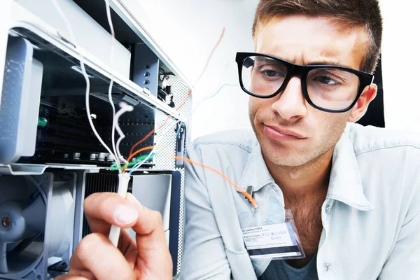 Computer tower, wire problem and man fixing studio hardware, PC equipment or check internal electricity power damage. Maintenance repair, technician inspection and IT specialist on white background.