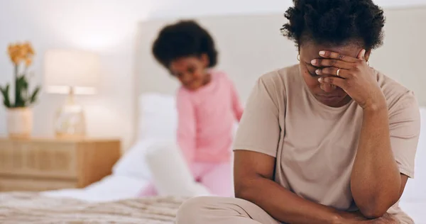 Frustrated mother, headache or child on bed in stress, anxiety or mental health at home. Tired African mom or single parent in depression, mistake or burnout with ADHD kid playing in bedroom at house.