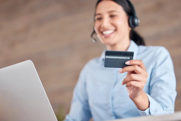 Happy woman, laptop and credit card at call center for payment, customer service or ecommerce at office. Female person, consultant or business agent smile with debit for online banking and support.