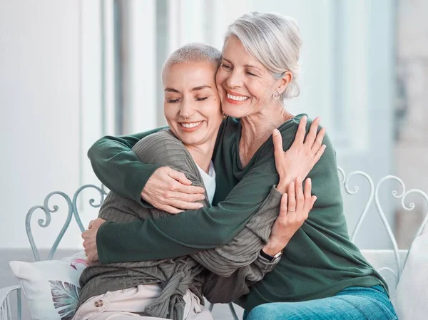Smile, hugging and senior mother with woman in the living room for bonding, love and care at home. Happy, sweet and elderly female person in retirement embracing adult daughter at house in Australia