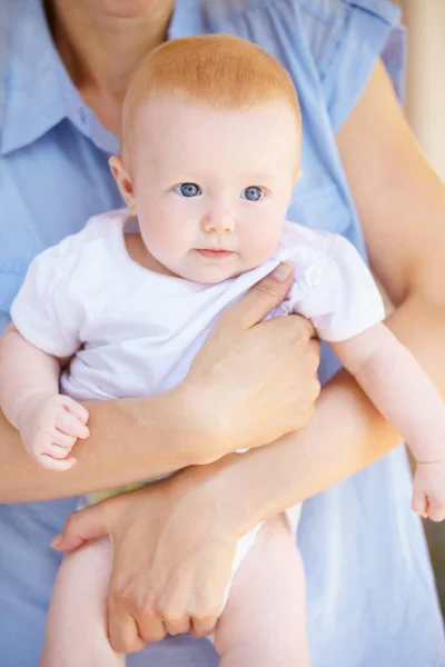 stock image Parents hands, baby or home family support, safety and carry newborn child growth, youth care or maternity. Security, relax and person holding, hug or embrace toddler for bonding, nurture or love.